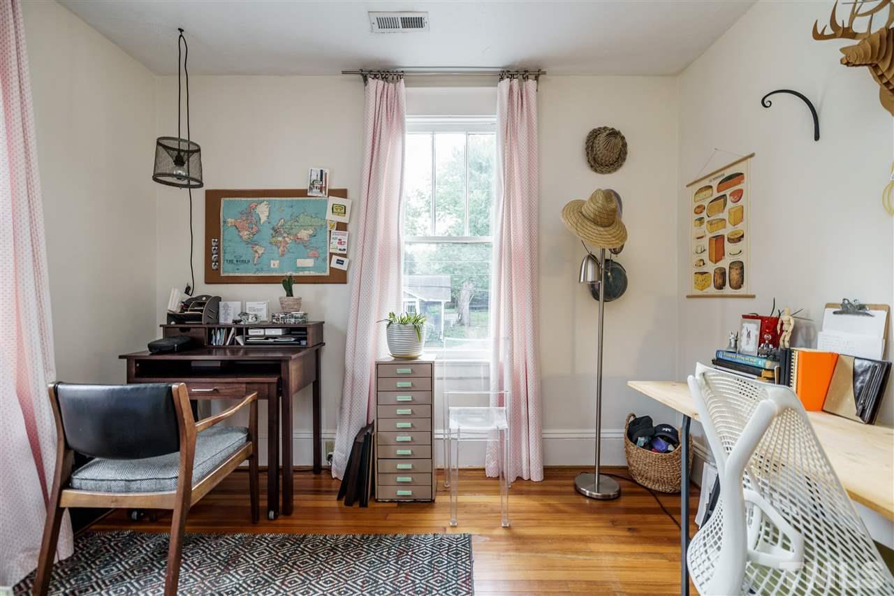 121 Hudson Street Raleigh, NC 27608 - Photo 25 of 30 a view of a workspace with furniture and a window