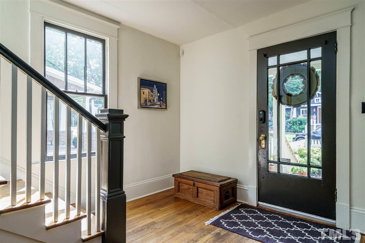 121 Hudson Street Raleigh, NC 27608 - Photo 5 of 30 a view of room with window and wooden floor