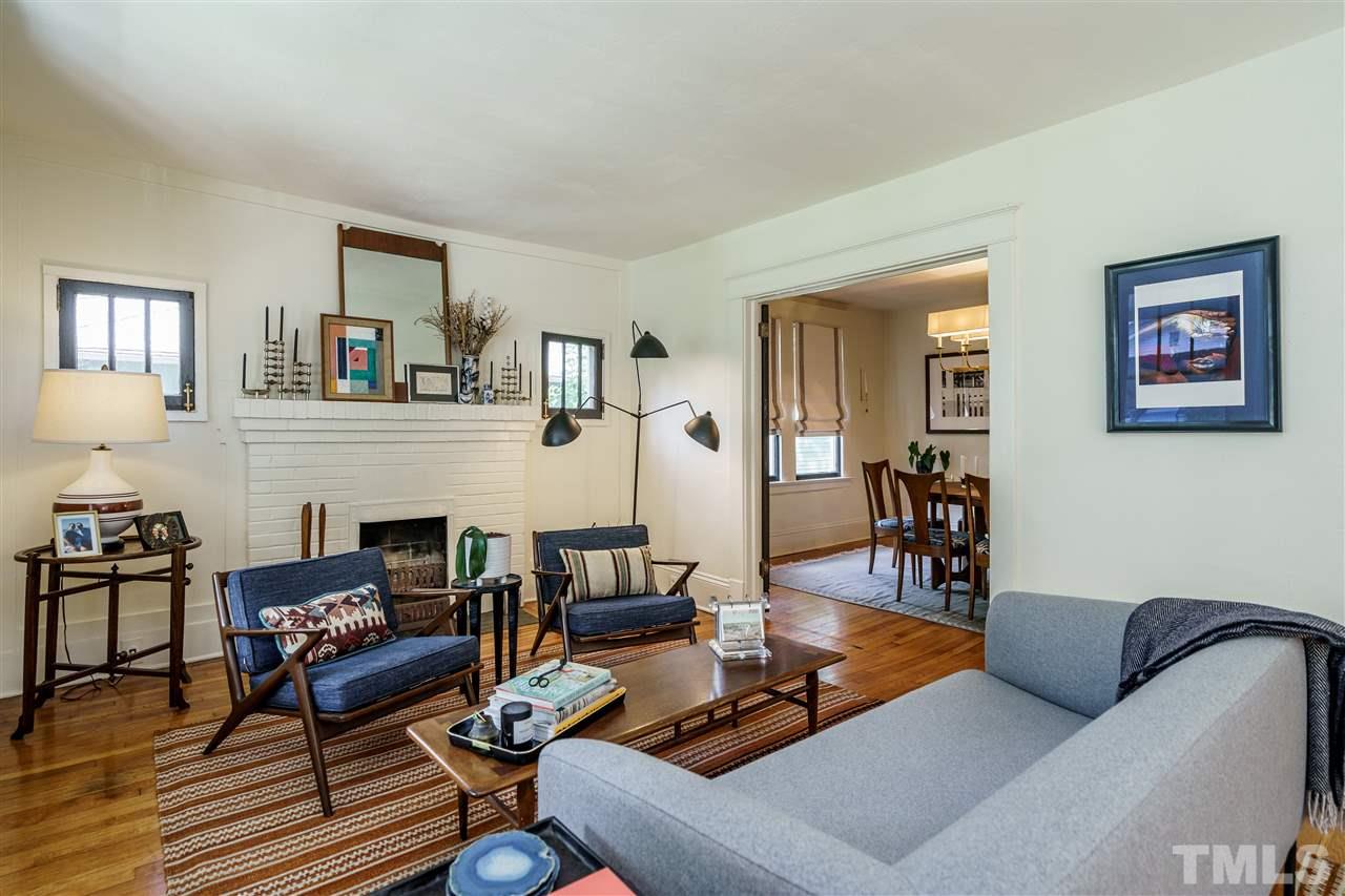 121 Hudson Street Raleigh, NC 27608 - Photo 6 of 30 a living room with furniture or couch and a fireplace
