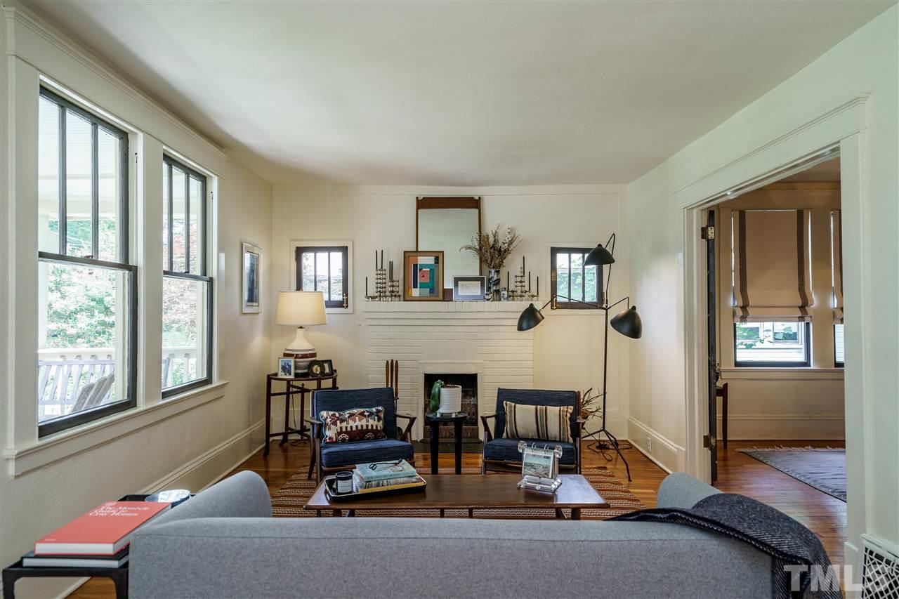 121 Hudson Street Raleigh, NC 27608 - Photo 7 of 30 a living room with furniture and large windows