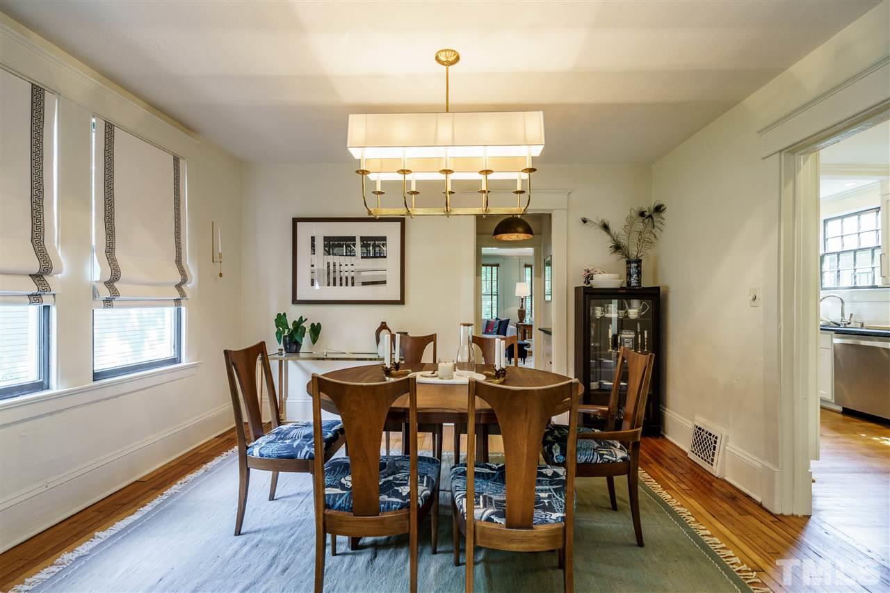 121 Hudson Street Raleigh, NC 27608 - Photo 10 of 30 a view of a dining room with furniture window and wooden floor