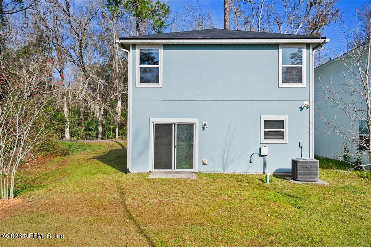 3094 Jennings Road Jacksonville, FL 32218 - Photo 24 of 33 front view of a house with a yard
