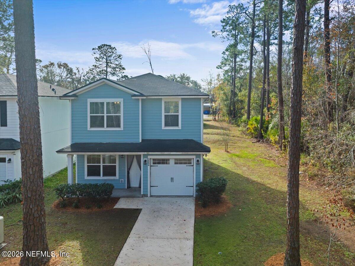 3094 Jennings Road Jacksonville, FL 32218 - Photo 27 of 33 a front view of a house with garden
