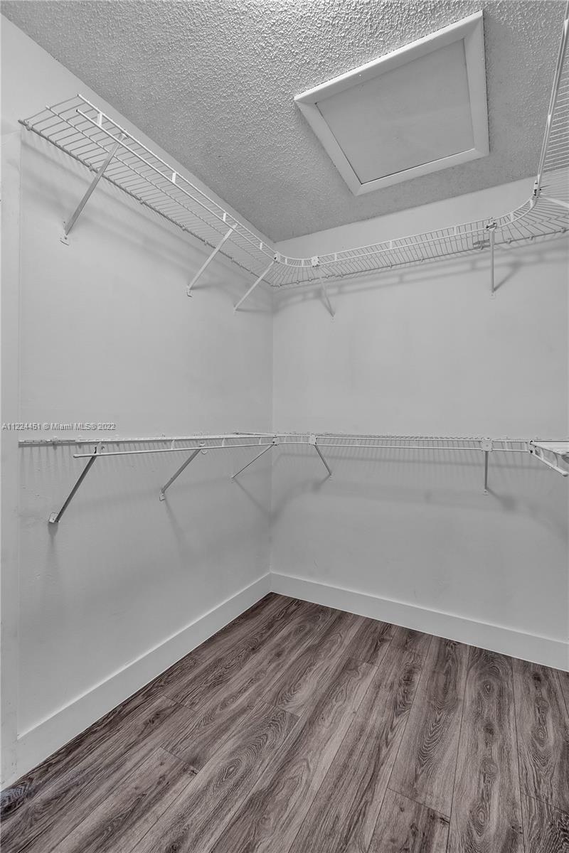 6211 Southwest 116th Place, Unit C22 Miami, FL 33173 - Photo 17 of 32 a view of a room with racks on the wall