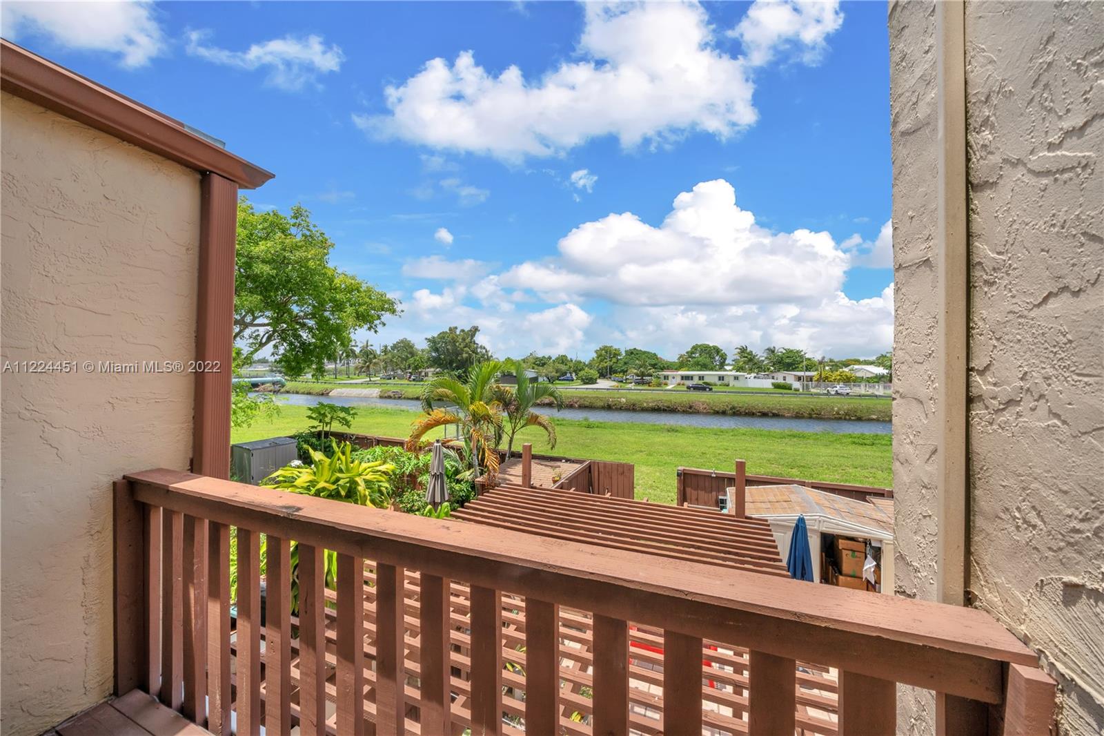 6211 Southwest 116th Place, Unit C22 Miami, FL 33173 - Photo 22 of 32 a view of a lake from a balcony