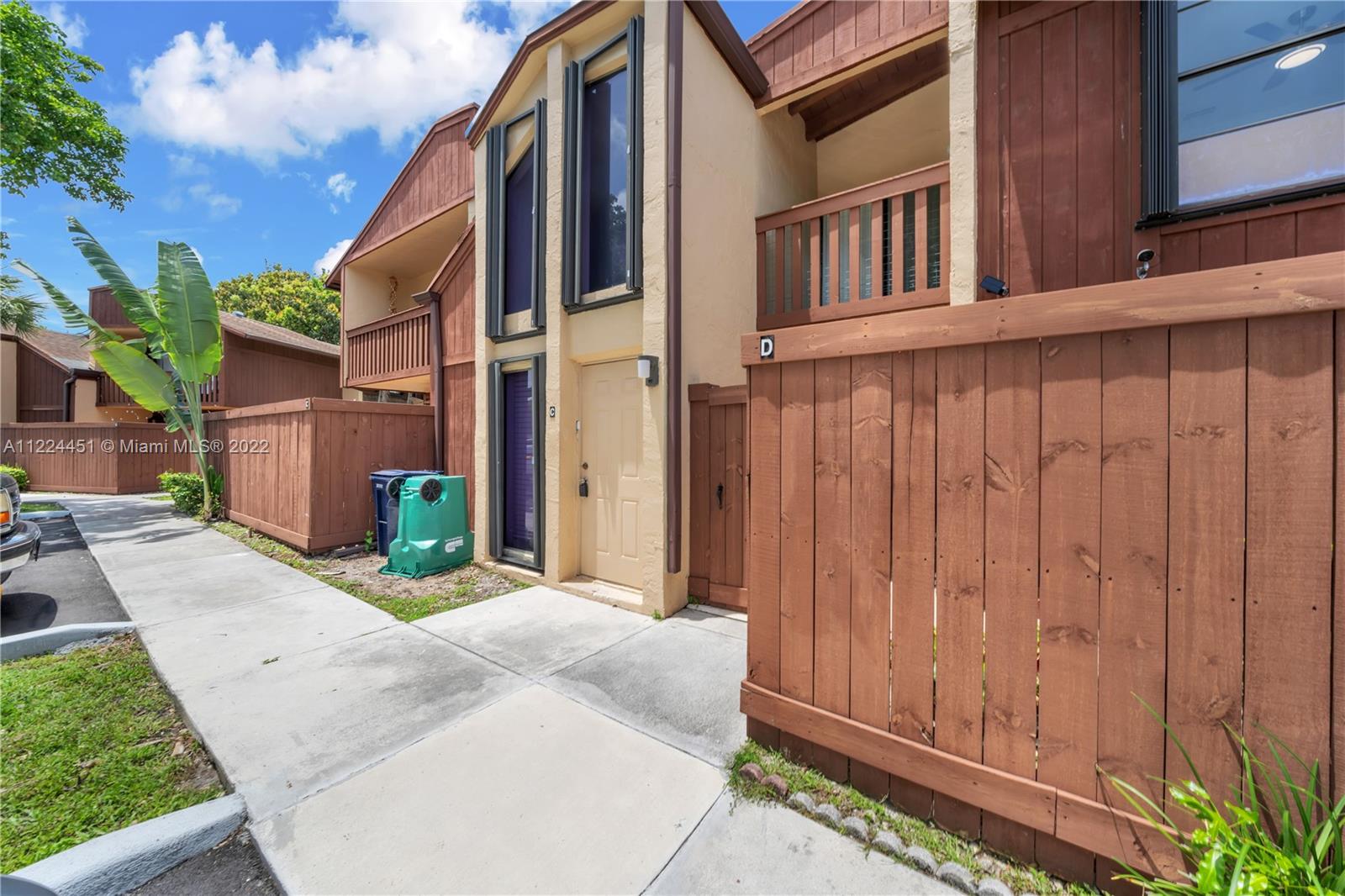 6211 Southwest 116th Place, Unit C22 Miami, FL 33173 - Photo 25 of 32 a view of a house with a backyard