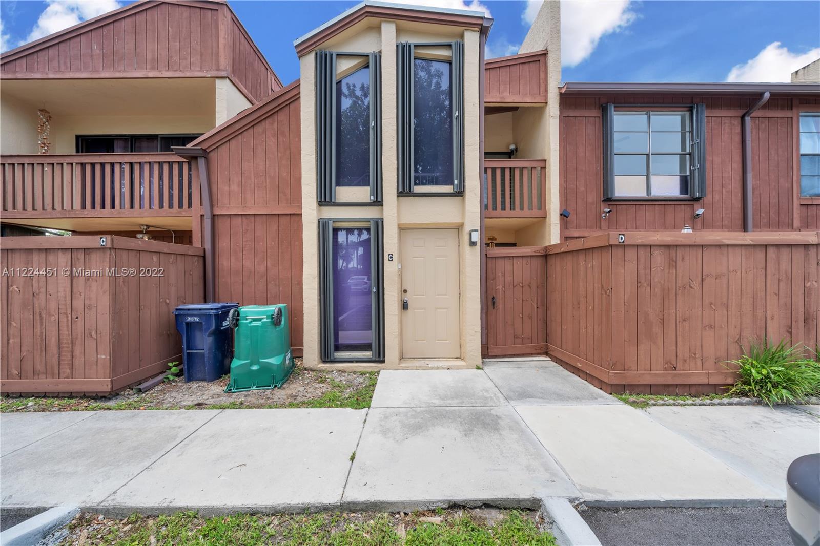 6211 Southwest 116th Place, Unit C22 Miami, FL 33173 - Photo 27 of 32 a view of a house with a garden