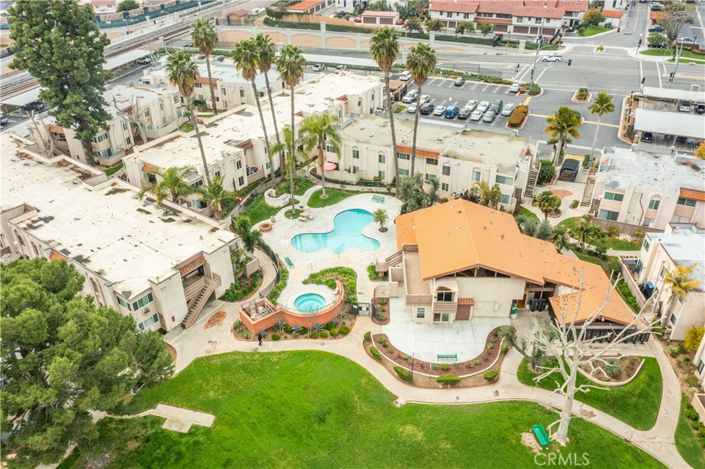 an aerial view of residential house with outdoor space and swimming pool
