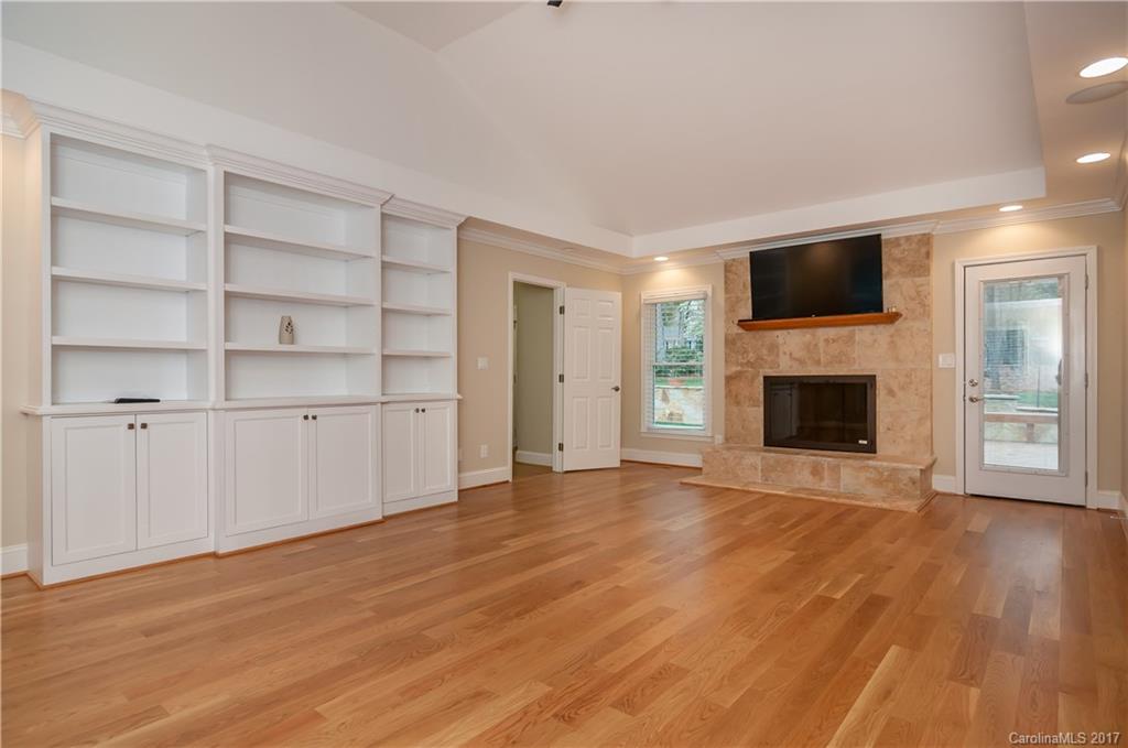 3936 Tilley Morris Road Matthews, NC 28105 - Photo 2 of 24 a view of an empty room with a fireplace and a window
