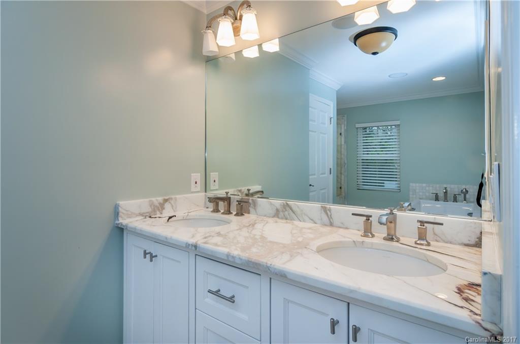 3936 Tilley Morris Road Matthews, NC 28105 - Photo 13 of 24 a bathroom with a sink and a mirror