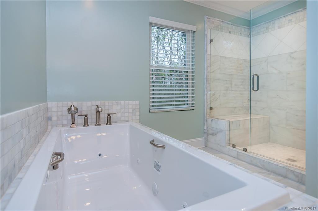 3936 Tilley Morris Road Matthews, NC 28105 - Photo 14 of 24 a bathroom with a bathtub and a sink