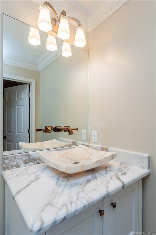 3936 Tilley Morris Road Matthews, NC 28105 - Photo 19 of 24 a bathroom with a sink and a mirror