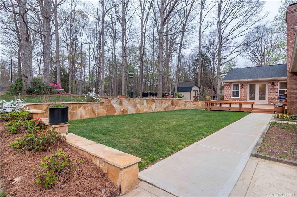 3936 Tilley Morris Road Matthews, NC 28105 - Photo 22 of 24 a view of a yard with plants and trees
