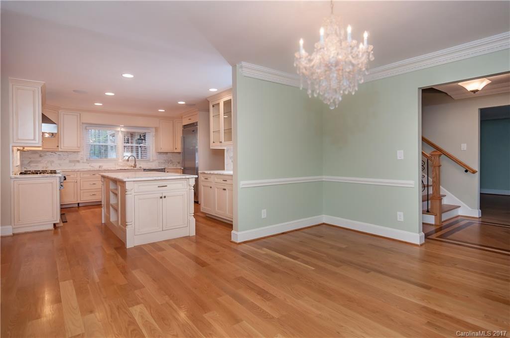 3936 Tilley Morris Road Matthews, NC 28105 - Photo 5 of 24 a view of a kitchen with cabinets and wooden floor