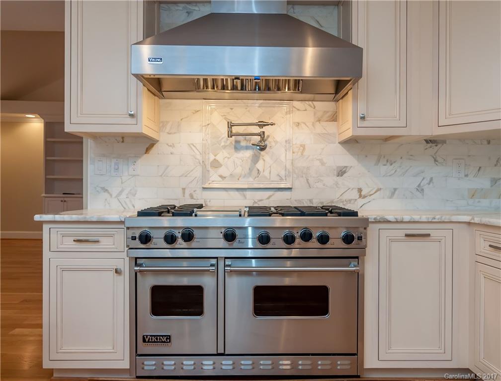 3936 Tilley Morris Road Matthews, NC 28105 - Photo 9 of 24 a stove top oven sitting inside of a kitchen