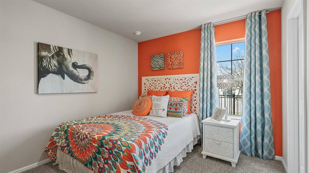 16457 Hudson Pr Way Justin, TX 76247 - Photo 26 of 38 a bedroom with a bed and a painting on the wall