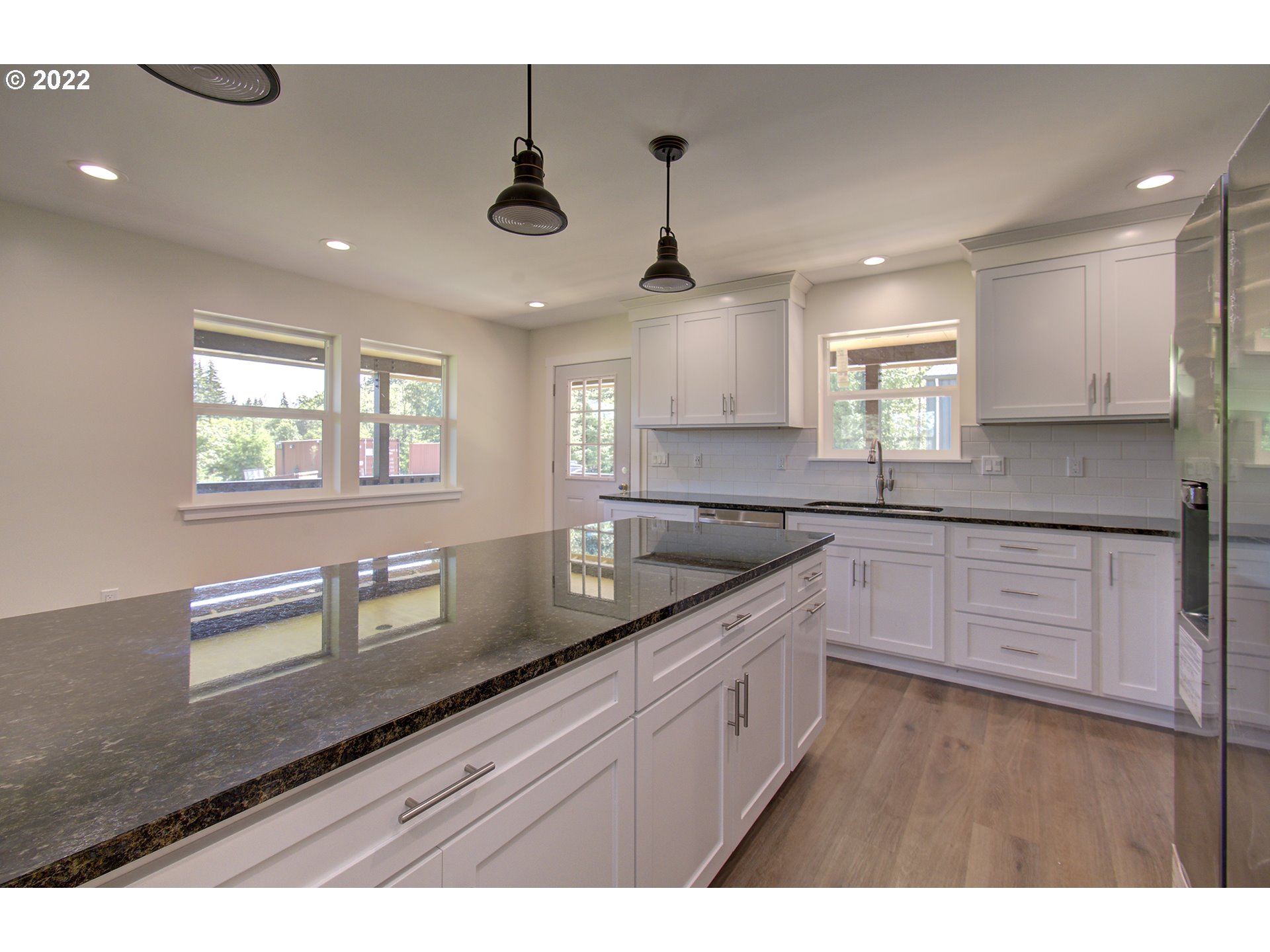 70446 Forest Park Road Rainier, OR 97048 - Photo 11 of 32 a kitchen with granite countertop a sink cabinets and window