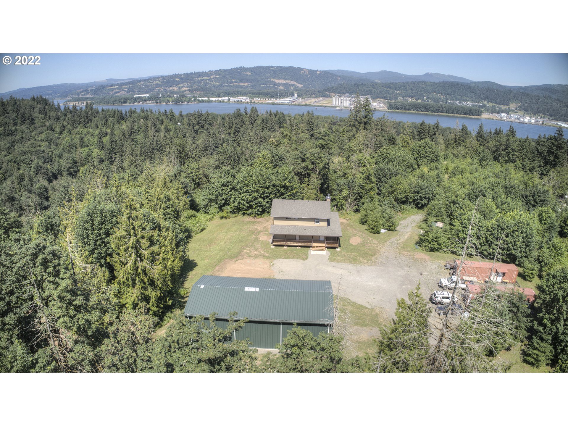 70446 Forest Park Road Rainier, OR 97048 - Photo 27 of 32 a view of a house with a yard