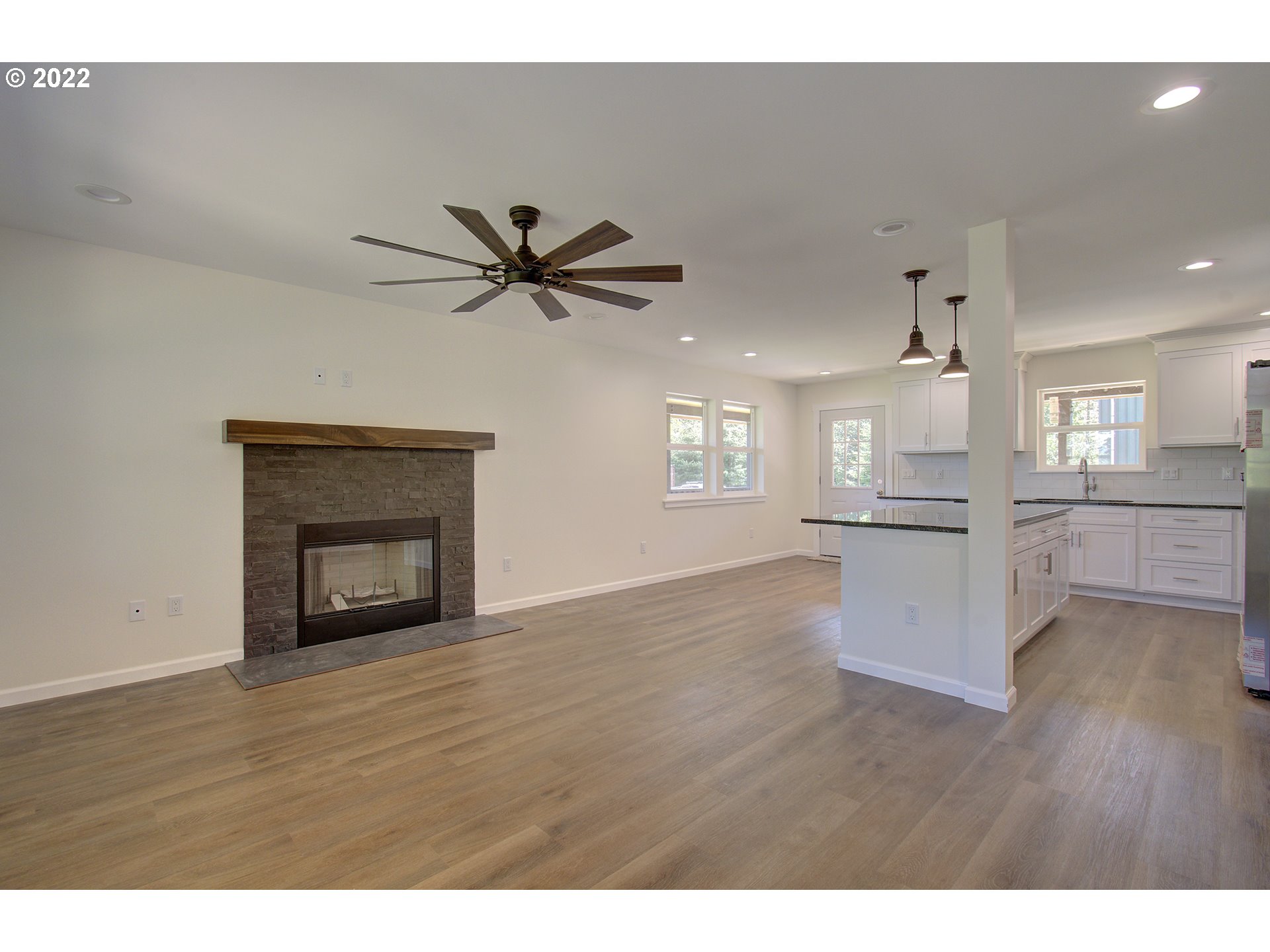 70446 Forest Park Road Rainier, OR 97048 - Photo 5 of 32 a view of a kitchen with wooden floor and a kitchen