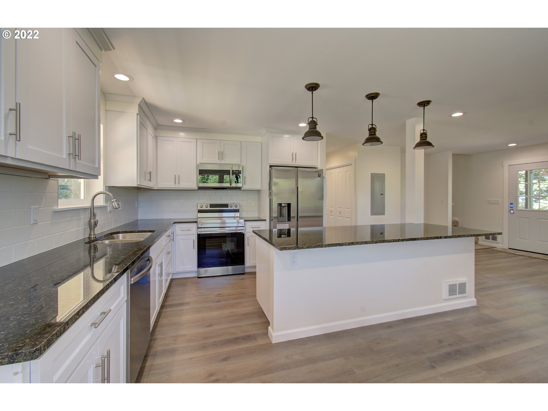 70446 Forest Park Road Rainier, OR 97048 - Photo 9 of 32 a large kitchen with stainless steel appliances granite countertop a stove a sink a refrigerator and a granite counter tops