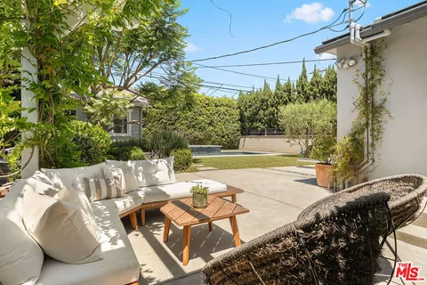 a view of yard with patio
