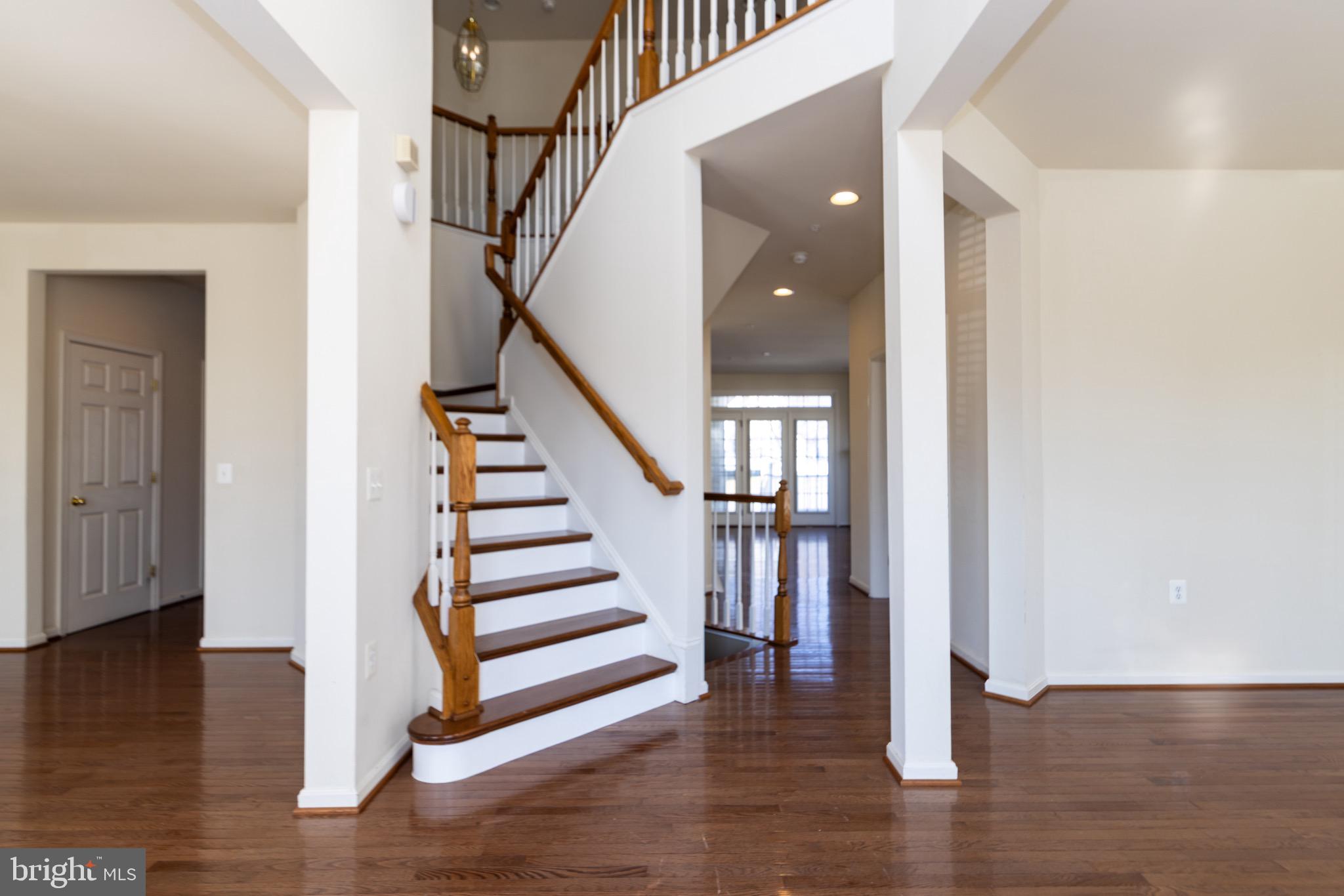 9814 Traver Street Bowie, MD 20721 - Photo 2 of 75 a view of entryway with wooden floor and stairs