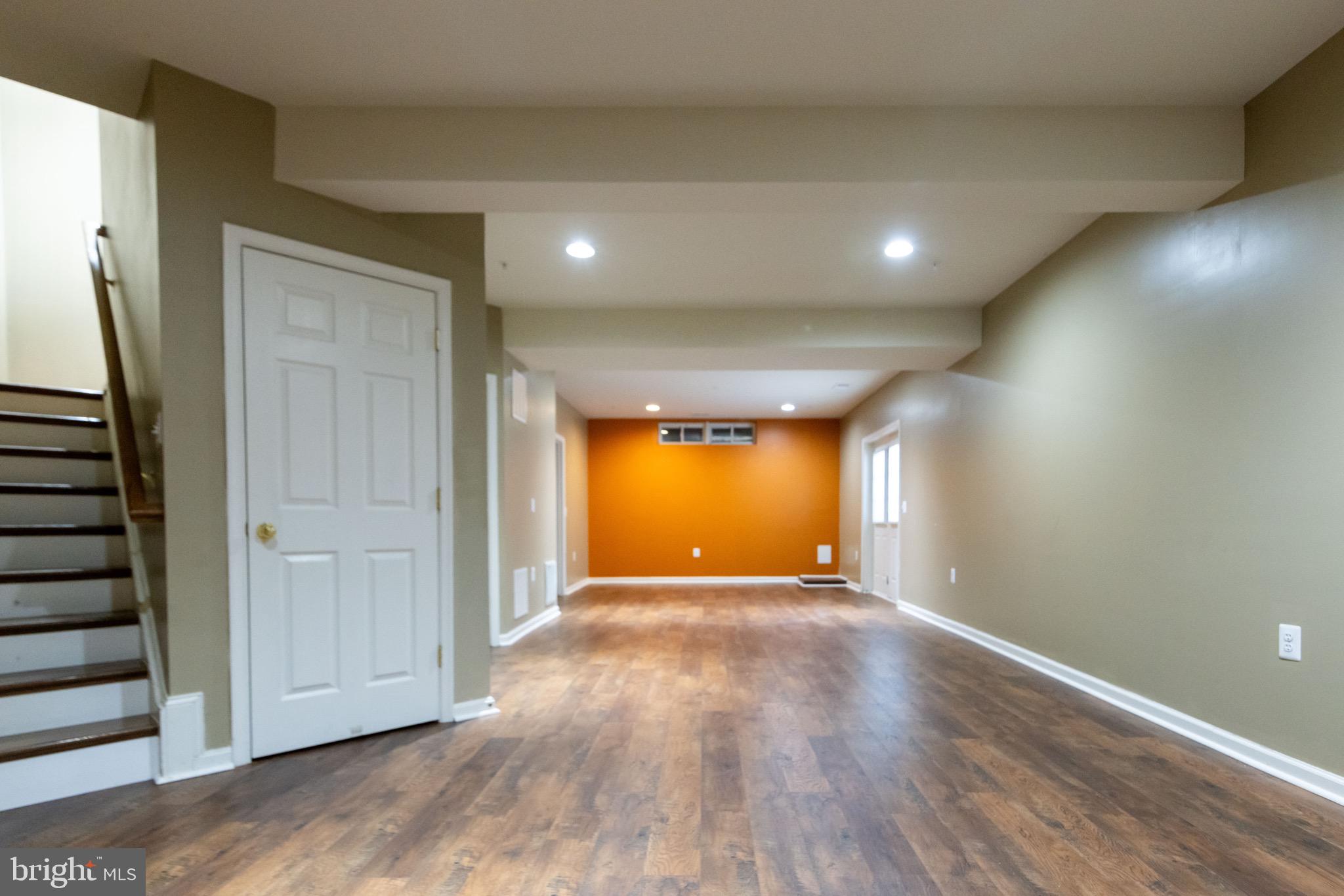 9814 Traver Street Bowie, MD 20721 - Photo 49 of 75 an empty room with wooden floor and windows