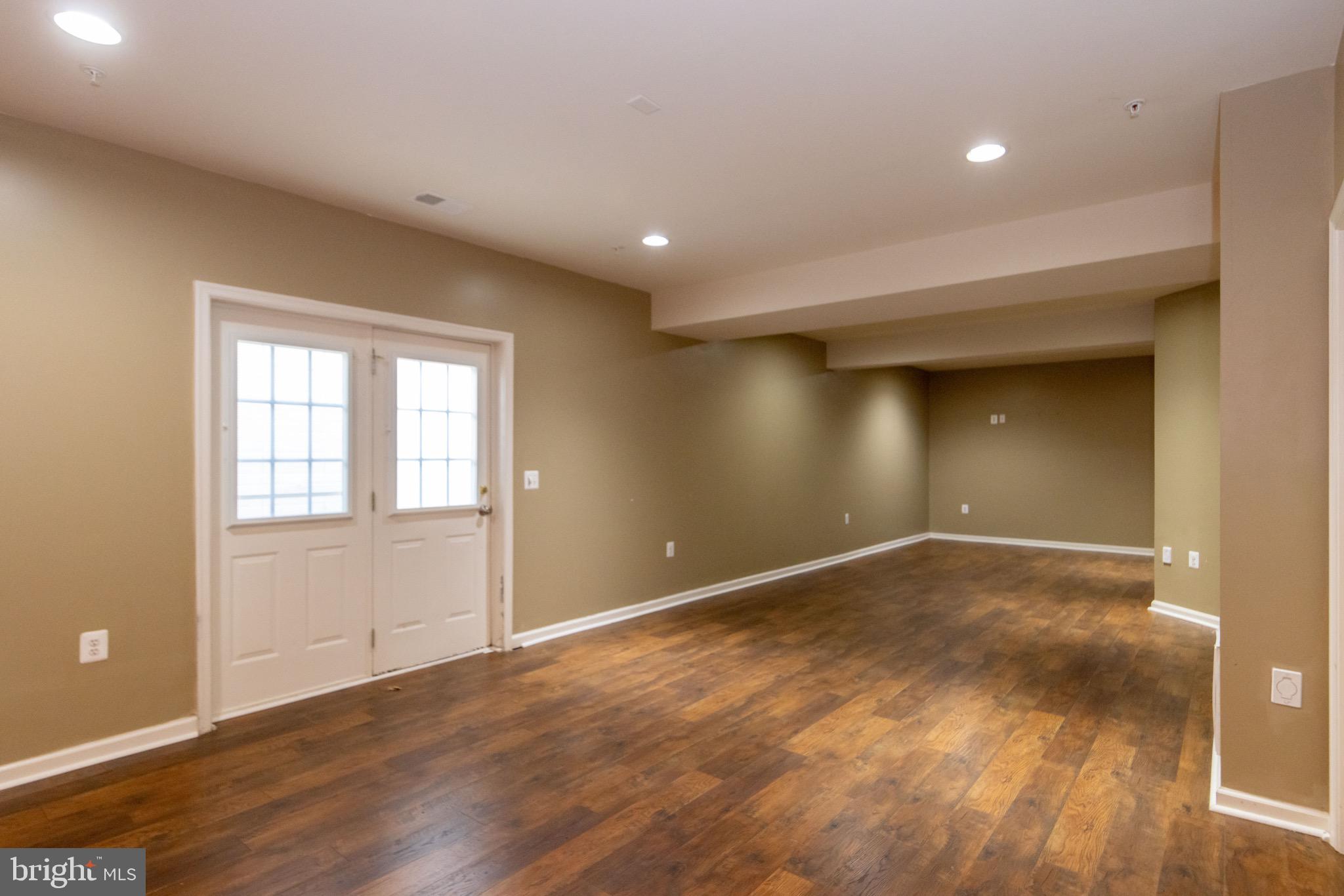 9814 Traver Street Bowie, MD 20721 - Photo 53 of 75 an empty room with wooden floor and windows