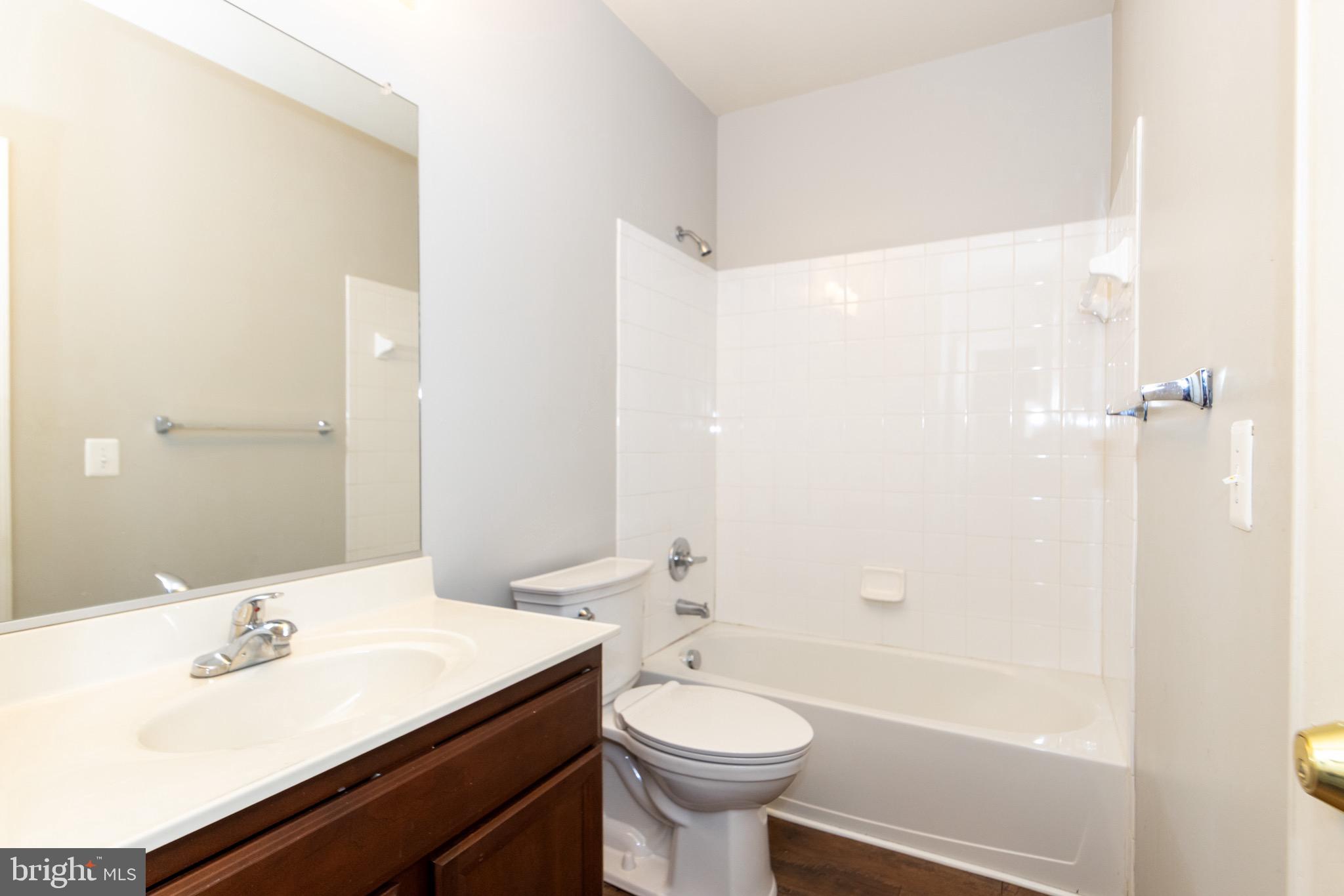9814 Traver Street Bowie, MD 20721 - Photo 54 of 75 a bathroom with a sink a toilet and shower