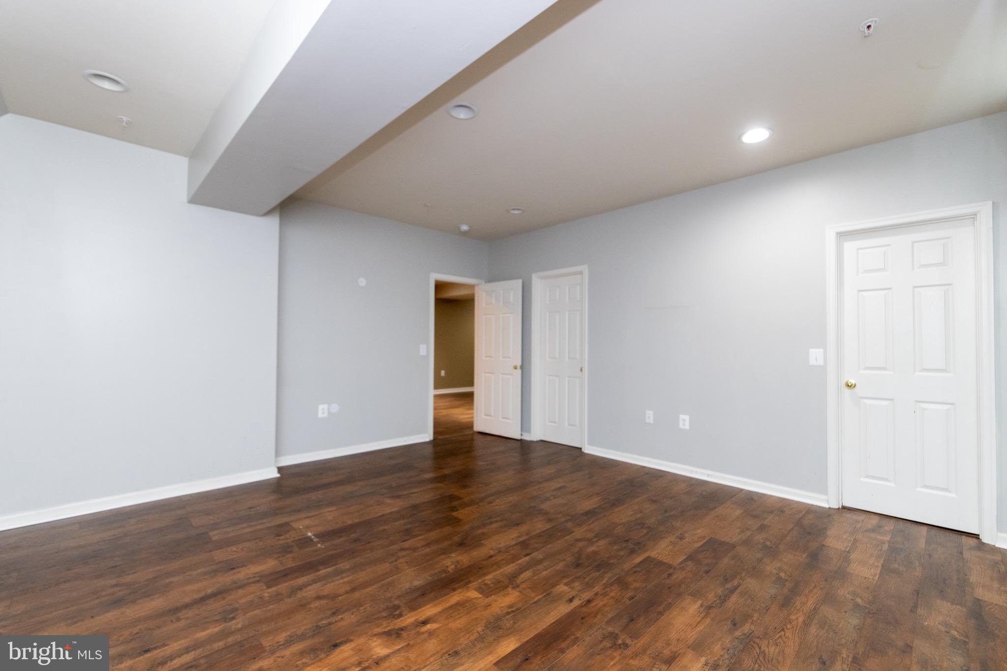 9814 Traver Street Bowie, MD 20721 - Photo 57 of 75 a view of an empty room with wooden floor