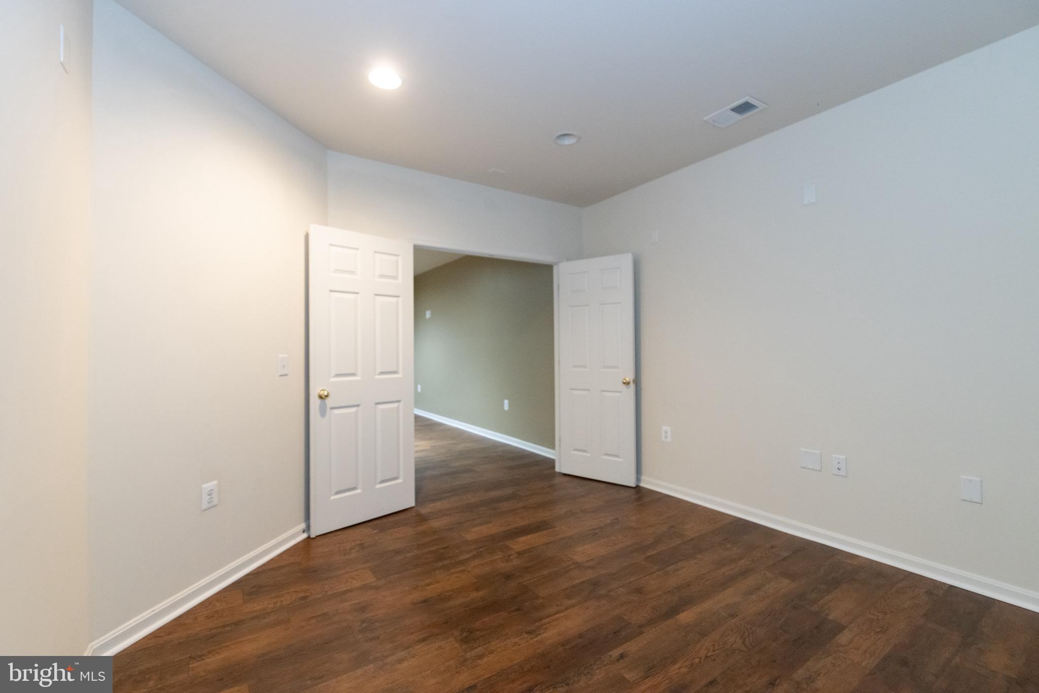 9814 Traver Street Bowie, MD 20721 - Photo 62 of 75 an empty room with wooden floor