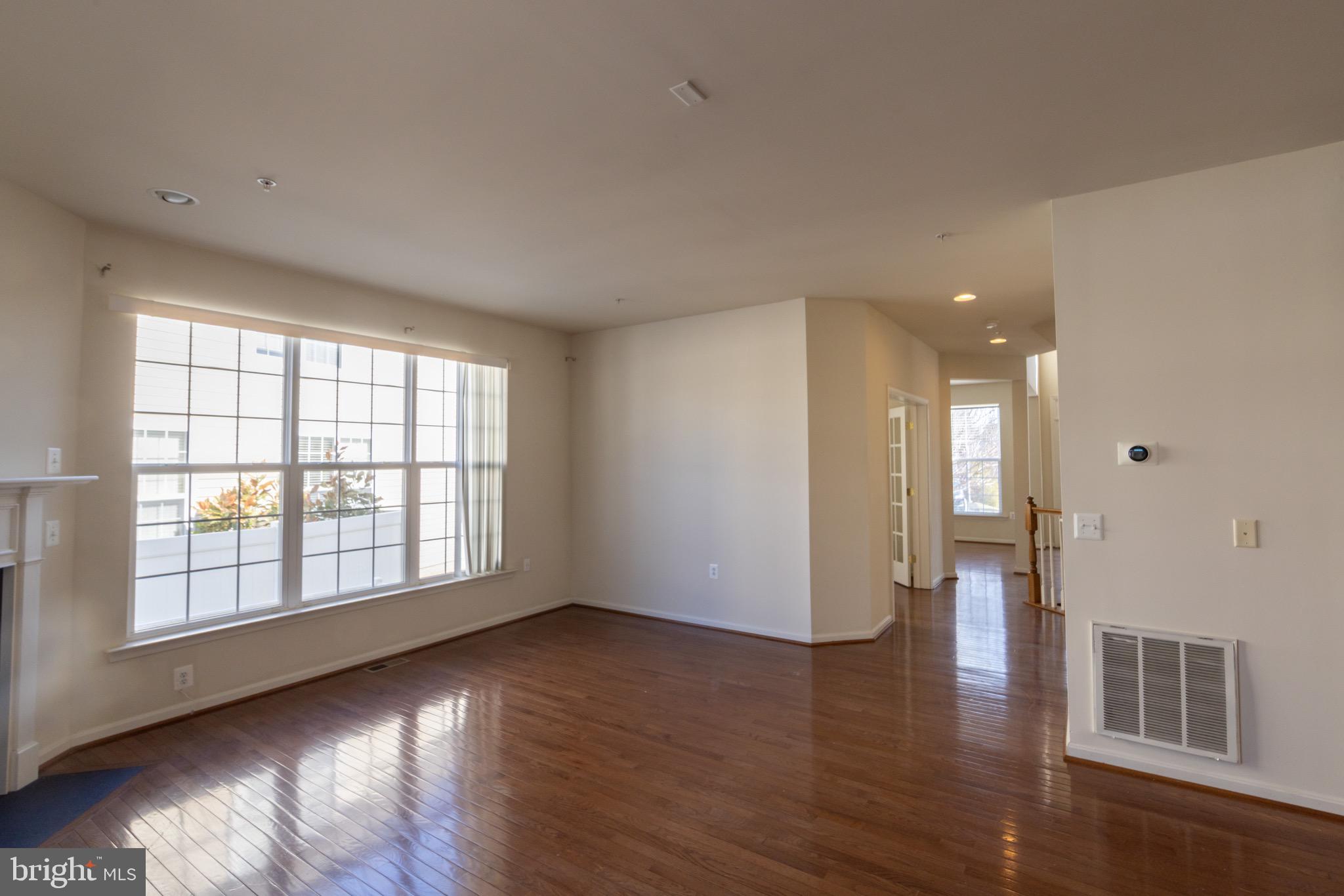 9814 Traver Street Bowie, MD 20721 - Photo 73 of 75 an empty room with wooden floor and windows