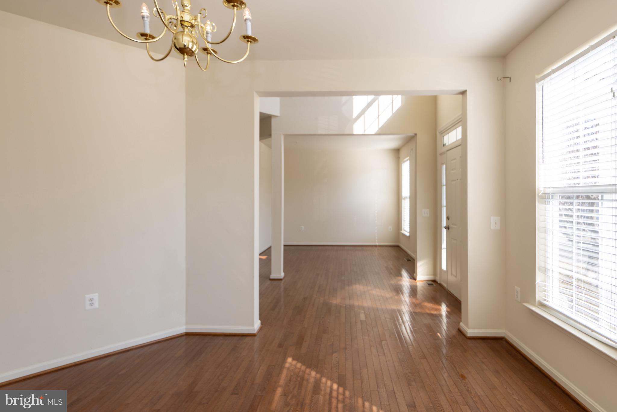 9814 Traver Street Bowie, MD 20721 - Photo 8 of 75 a view of livingroom with hardwood floor and window