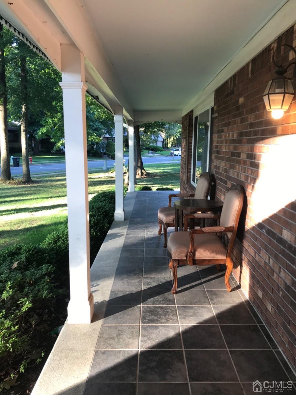 27 Fox Hill Road Edison, NJ 08820 - Photo 2 of 27 a building outdoor space with patio furniture and garden