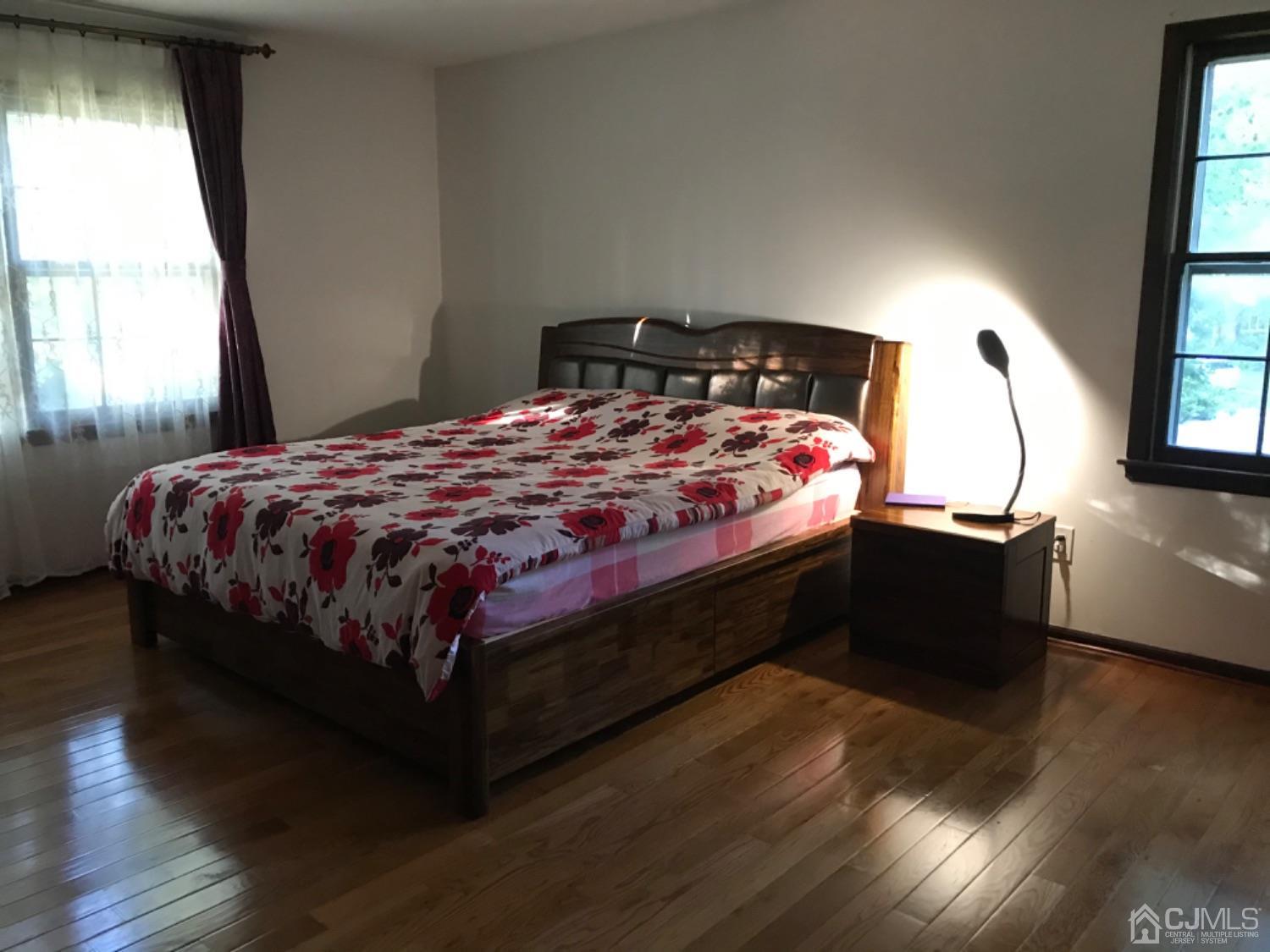 27 Fox Hill Road Edison, NJ 08820 - Photo 14 of 27 a bed sitting in a bedroom next to a window