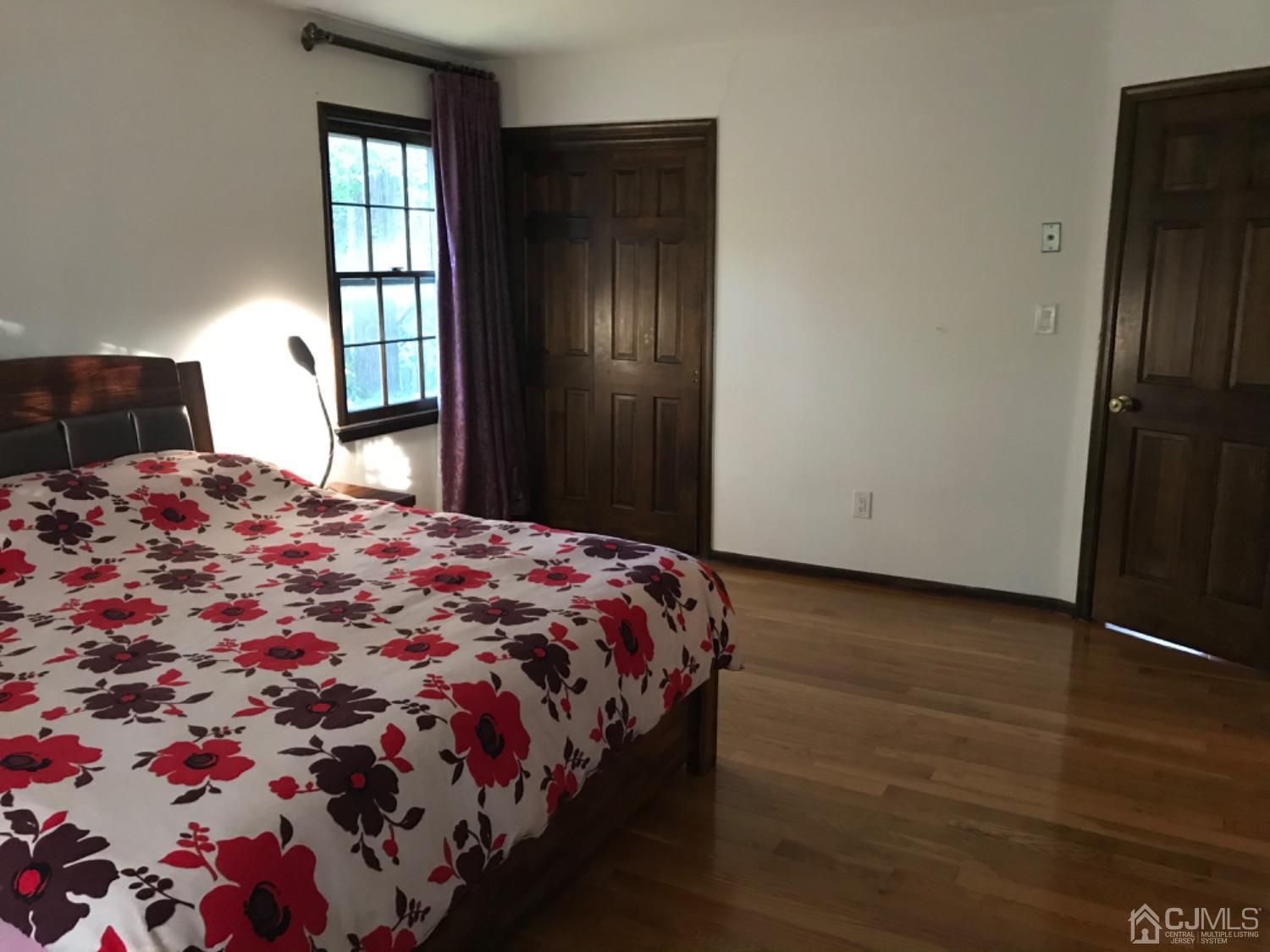 27 Fox Hill Road Edison, NJ 08820 - Photo 17 of 27 a bedroom with a bed and a window