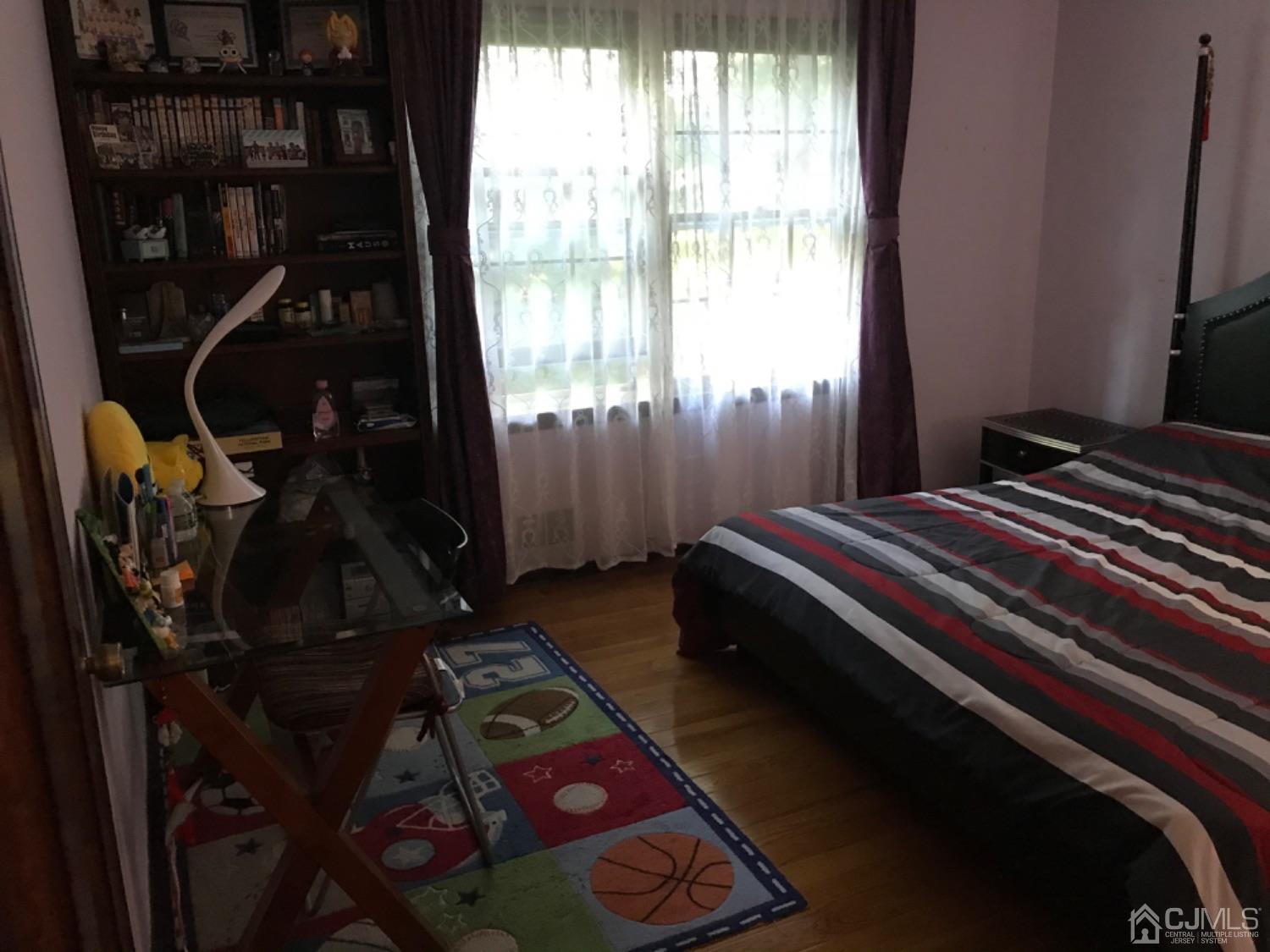 27 Fox Hill Road Edison, NJ 08820 - Photo 20 of 27 a bedroom with a bed next to a window