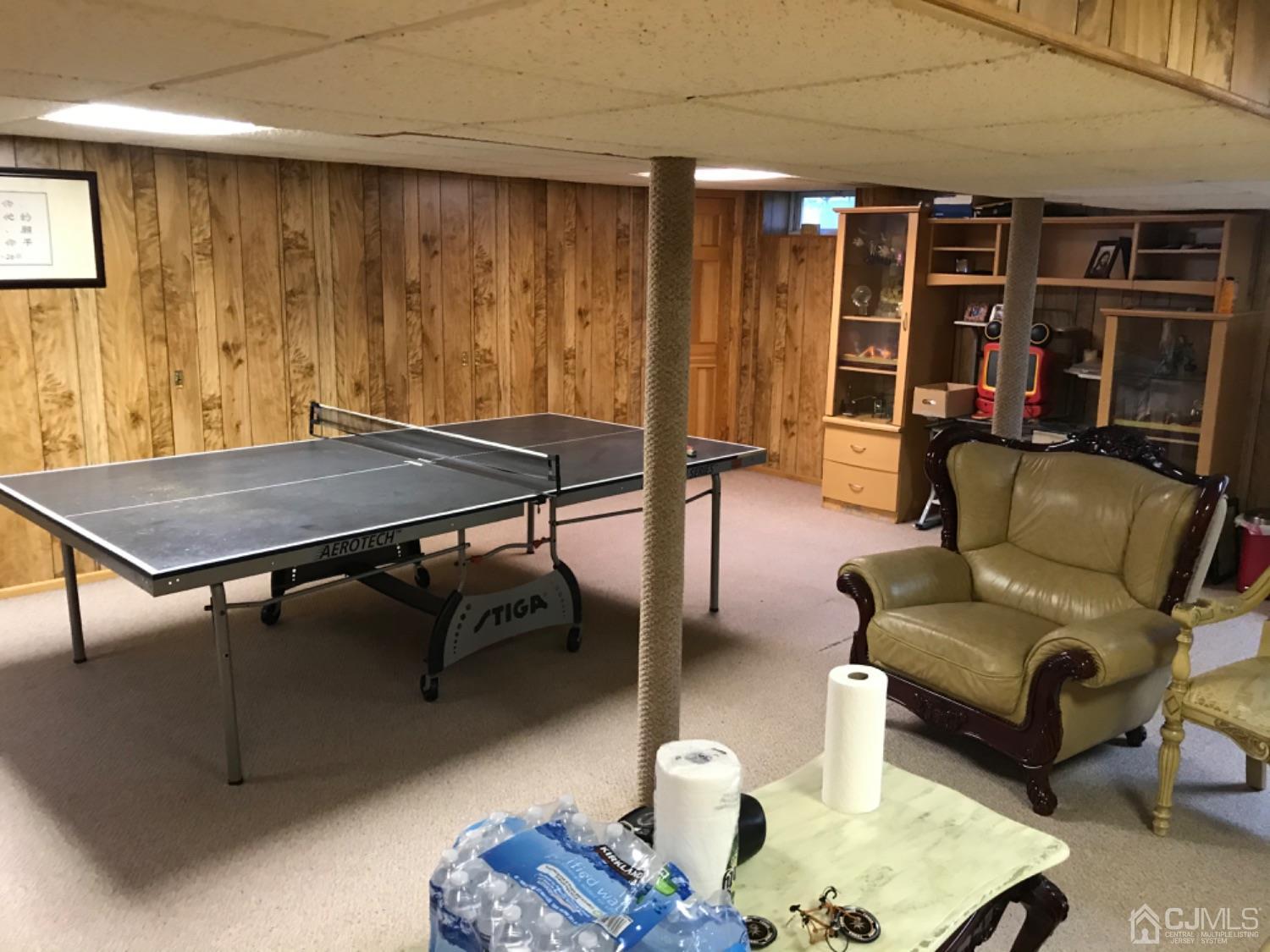 27 Fox Hill Road Edison, NJ 08820 - Photo 24 of 27 a living room with furniture a rug and a window