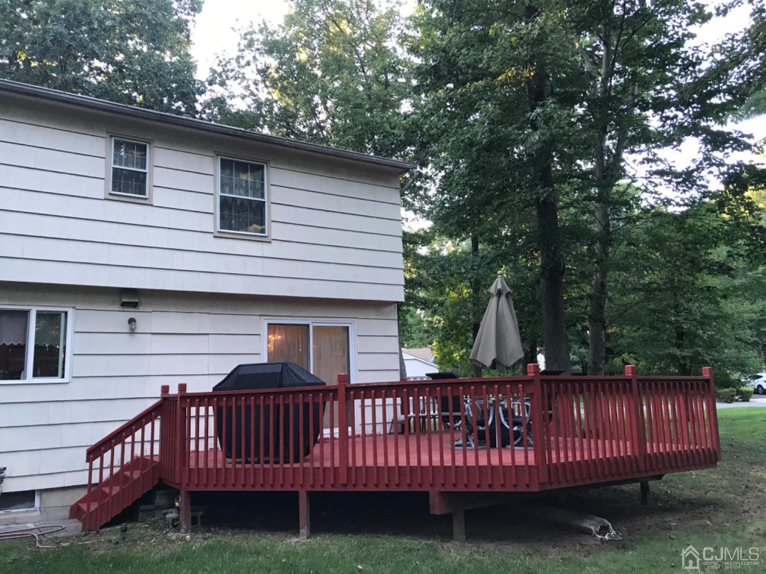 27 Fox Hill Road Edison, NJ 08820 - Photo 26 of 27 a view of a deck with a large window and fence