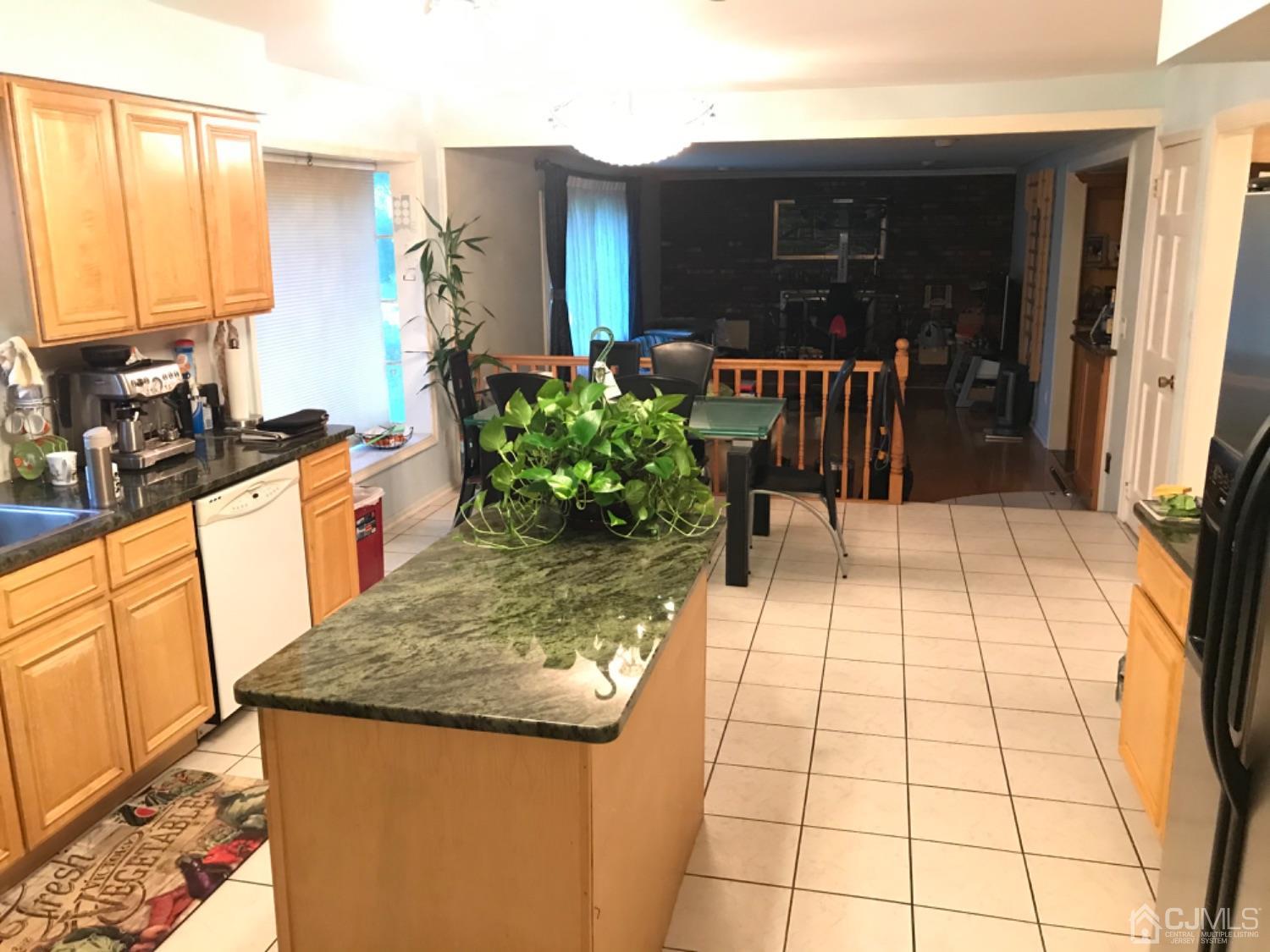 27 Fox Hill Road Edison, NJ 08820 - Photo 6 of 27 a view of a kitchen area with furniture and wooden floor