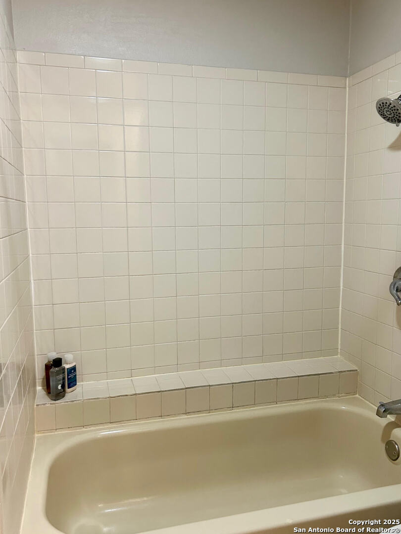 11843 Braesview, Unit 1612 San Antonio, TX 78231 - Photo 15 of 31 a bathroom with a bathtub