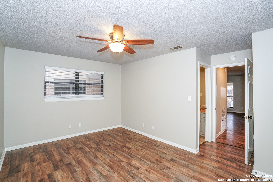 11843 Braesview, Unit 1612 San Antonio, TX 78231 - Photo 19 of 31 a view of empty room with wooden floor