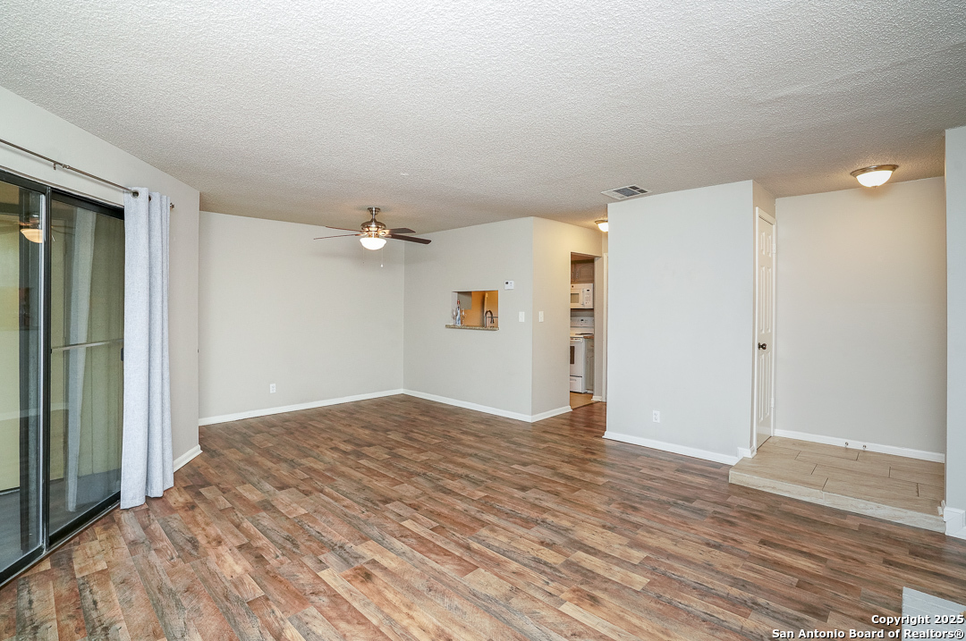 11843 Braesview, Unit 1612 San Antonio, TX 78231 - Photo 5 of 31 a view of empty room with wooden floor