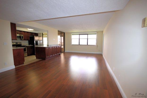 1648 Jupiter Cove Drive Jupiter, FL 33469 - Photo 6 of 21 Living room- kitchen 2
