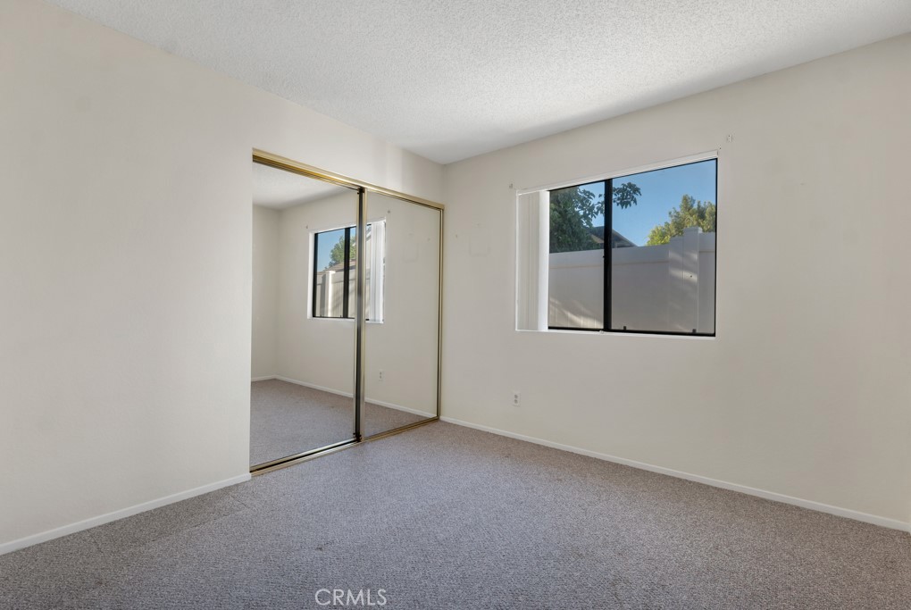 1440 Fox Run Corona, CA 92882 - Photo 15 of 23 an empty room with windows and closet