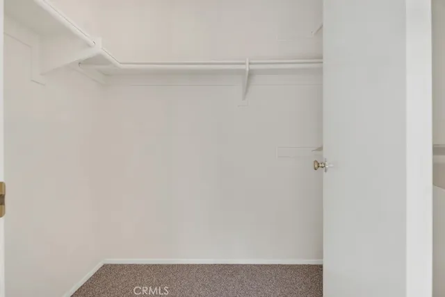 a bathroom with a double vanity sink toilet mirror and shower