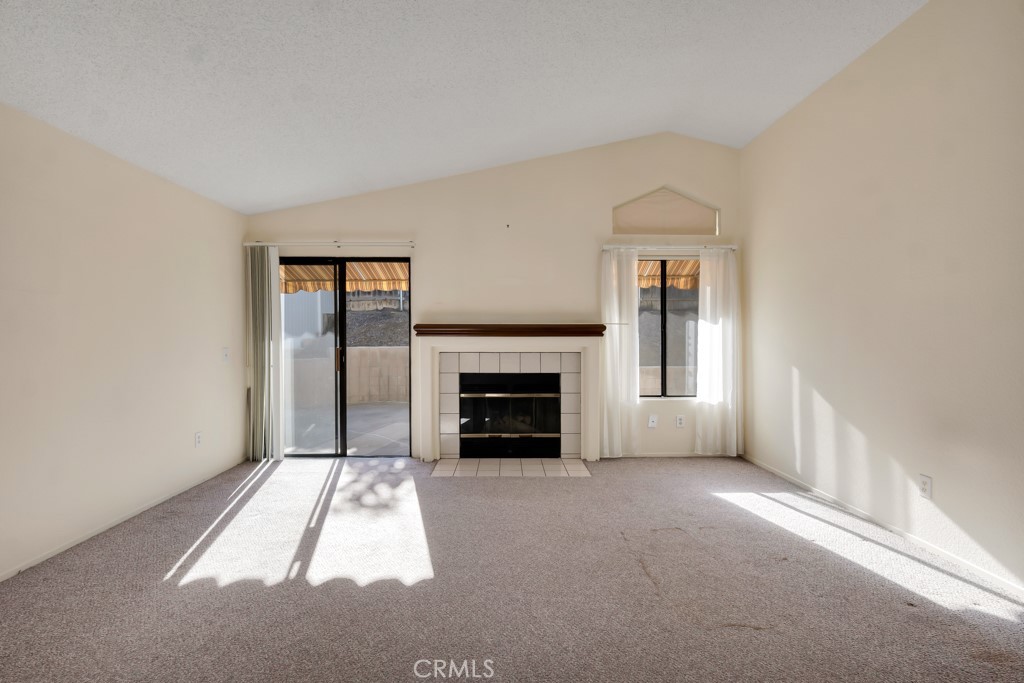 1440 Fox Run Corona, CA 92882 - Photo 5 of 23 a view of a livingroom with a fireplace and window