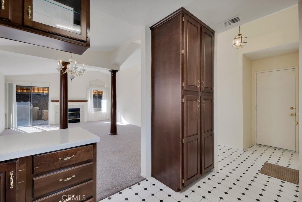 1440 Fox Run Corona, CA 92882 - Photo 8 of 23 a bathroom with a sink a mirror and a shower