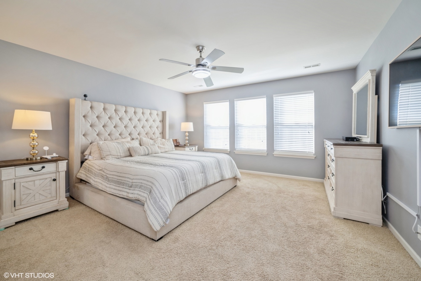 2624 Maple Circle West Dundee, IL 60118 - Photo 16 of 37 a bedroom with a large bed and a chandelier