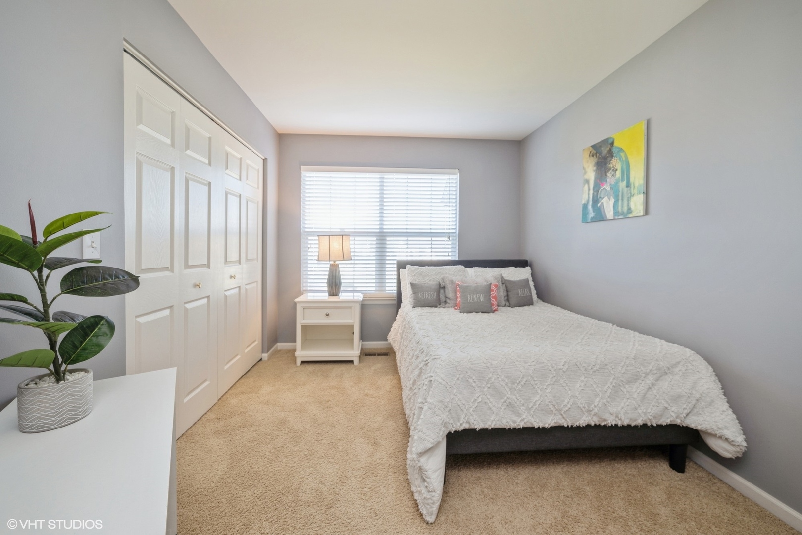 2624 Maple Circle West Dundee, IL 60118 - Photo 19 of 37 a bedroom with a bed and a potted plant